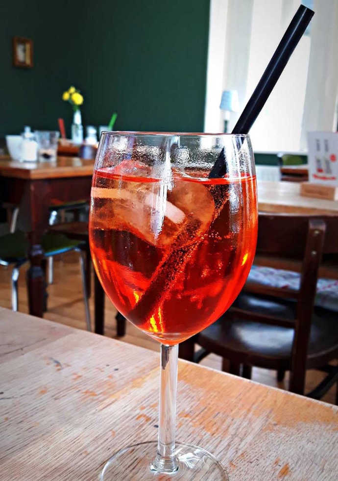 zuhause cafe interior cafe room with aperol glass