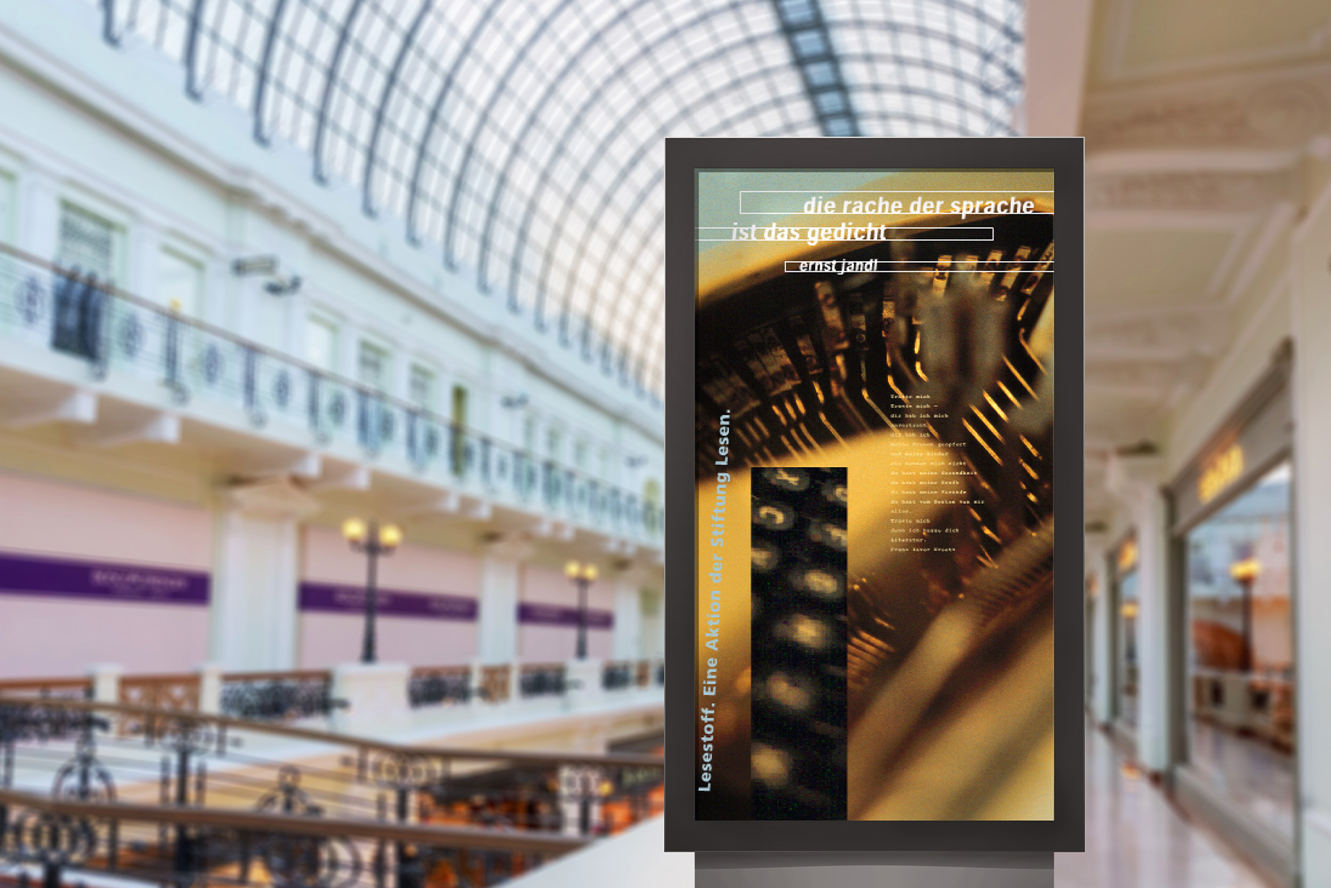 large shopping hall with a round glass dome, in the center a billboard with a poster, with a photo of the inside of a piano is printed with a poem on it.