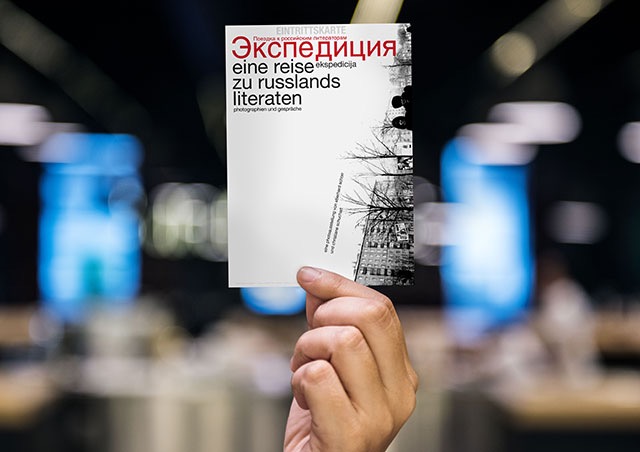 ekspedicija postcard hand holding the ekspedicija postcard in front of a blurred background
