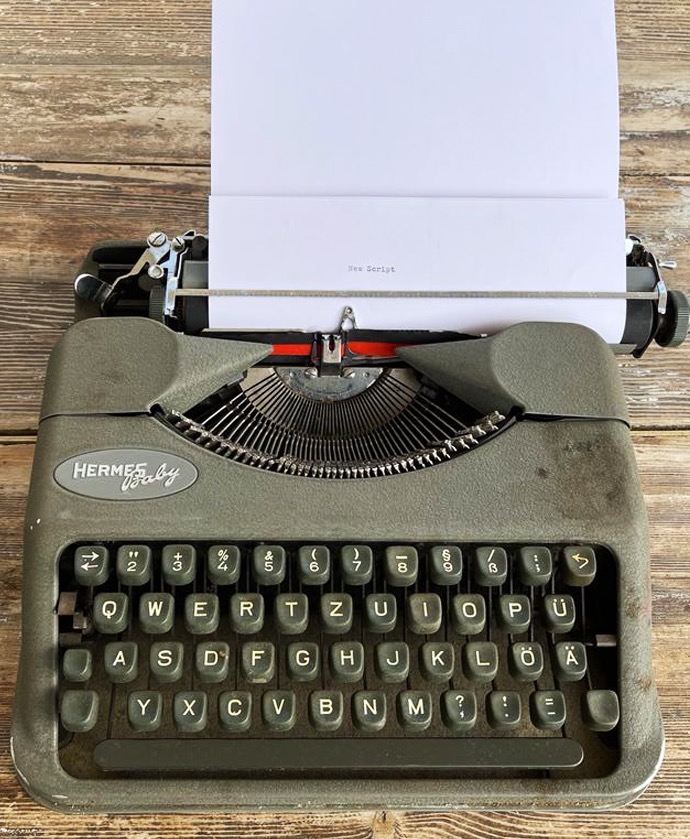 script development old typewriter with new script